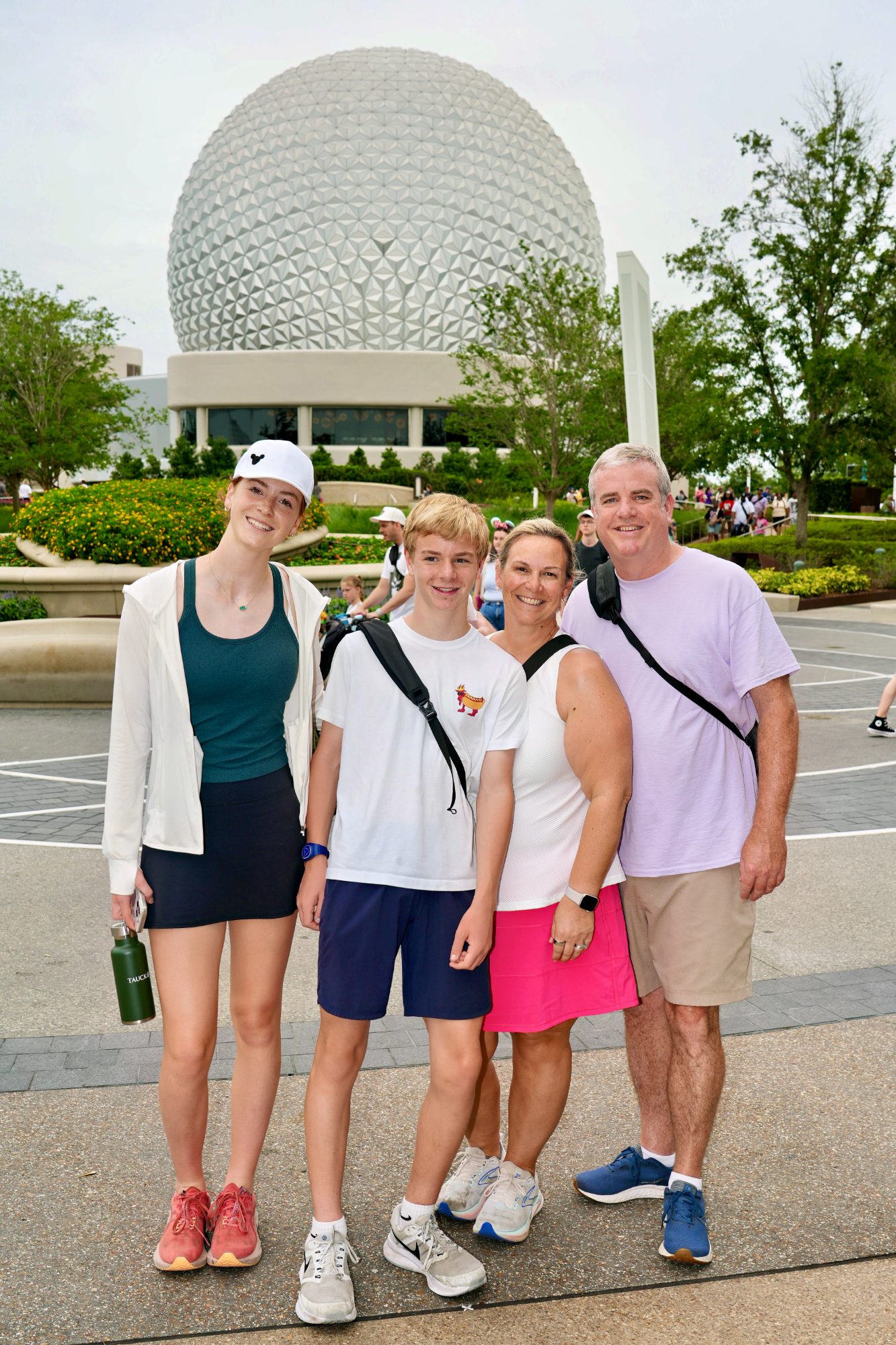 The family in front of Spaceship Earth at Epcot