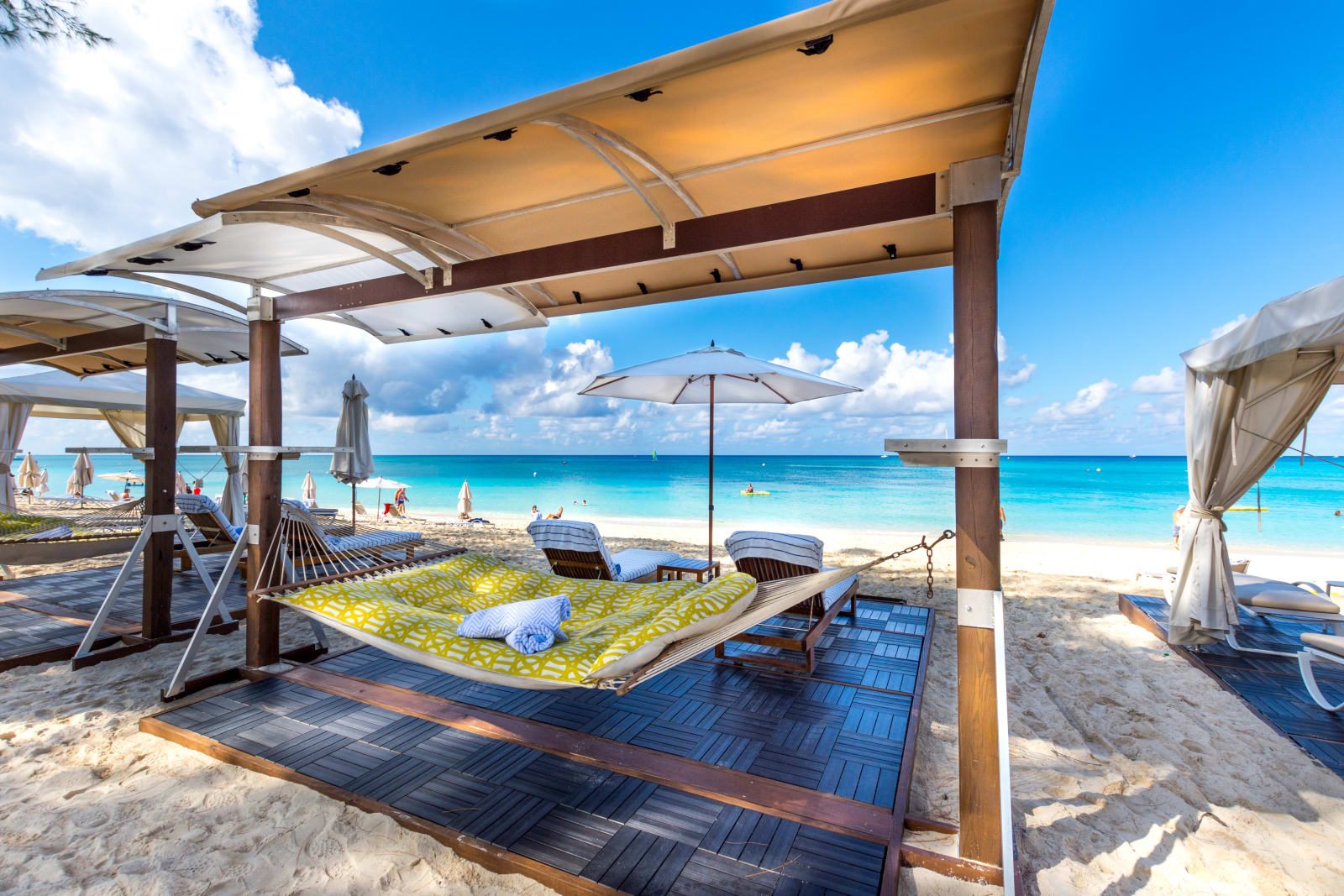 A shaded cabana daybed on Seven Mile Beach, Grand Cayman