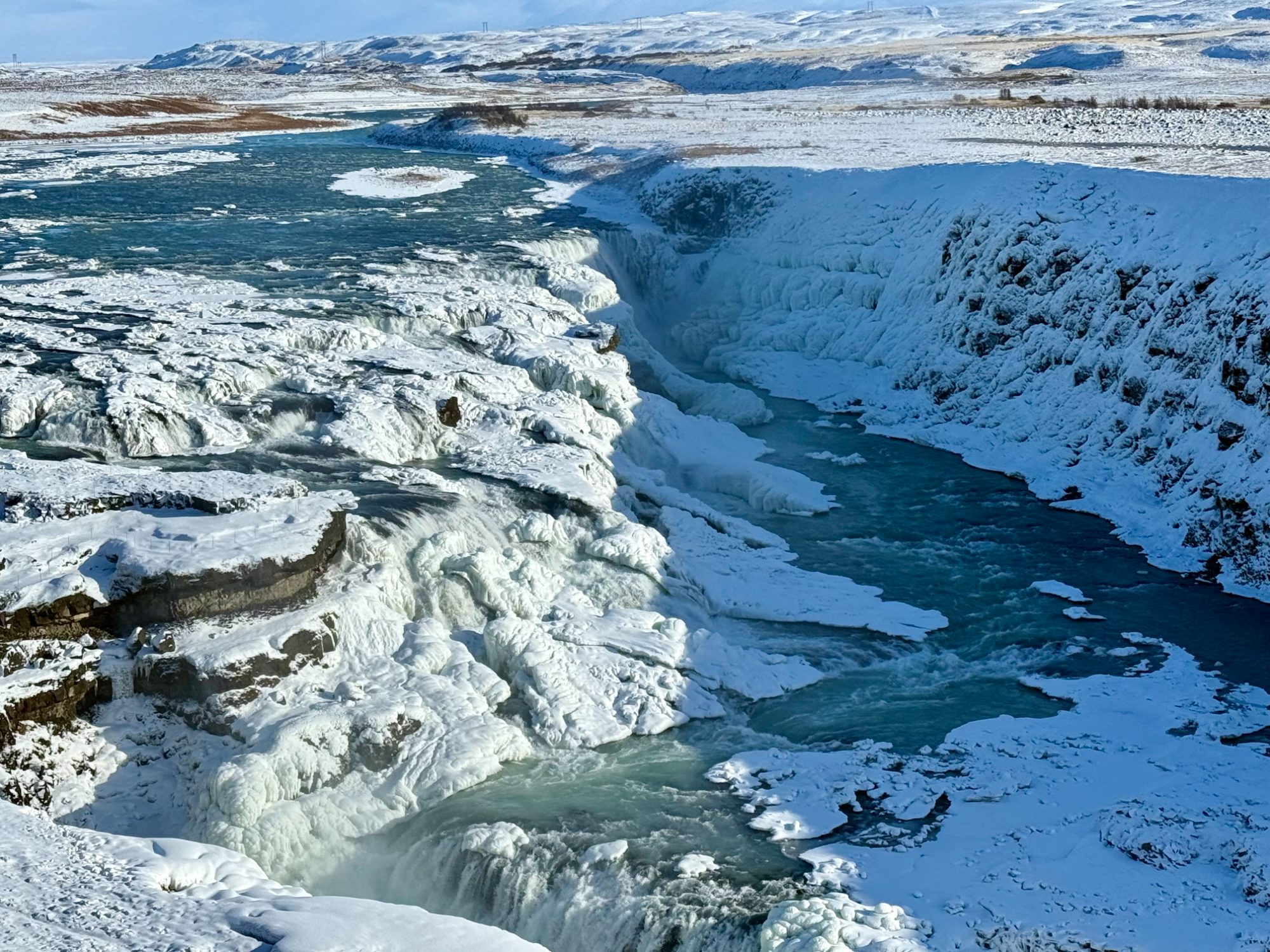 Gullfoss waterfall framed by winter ice and snow