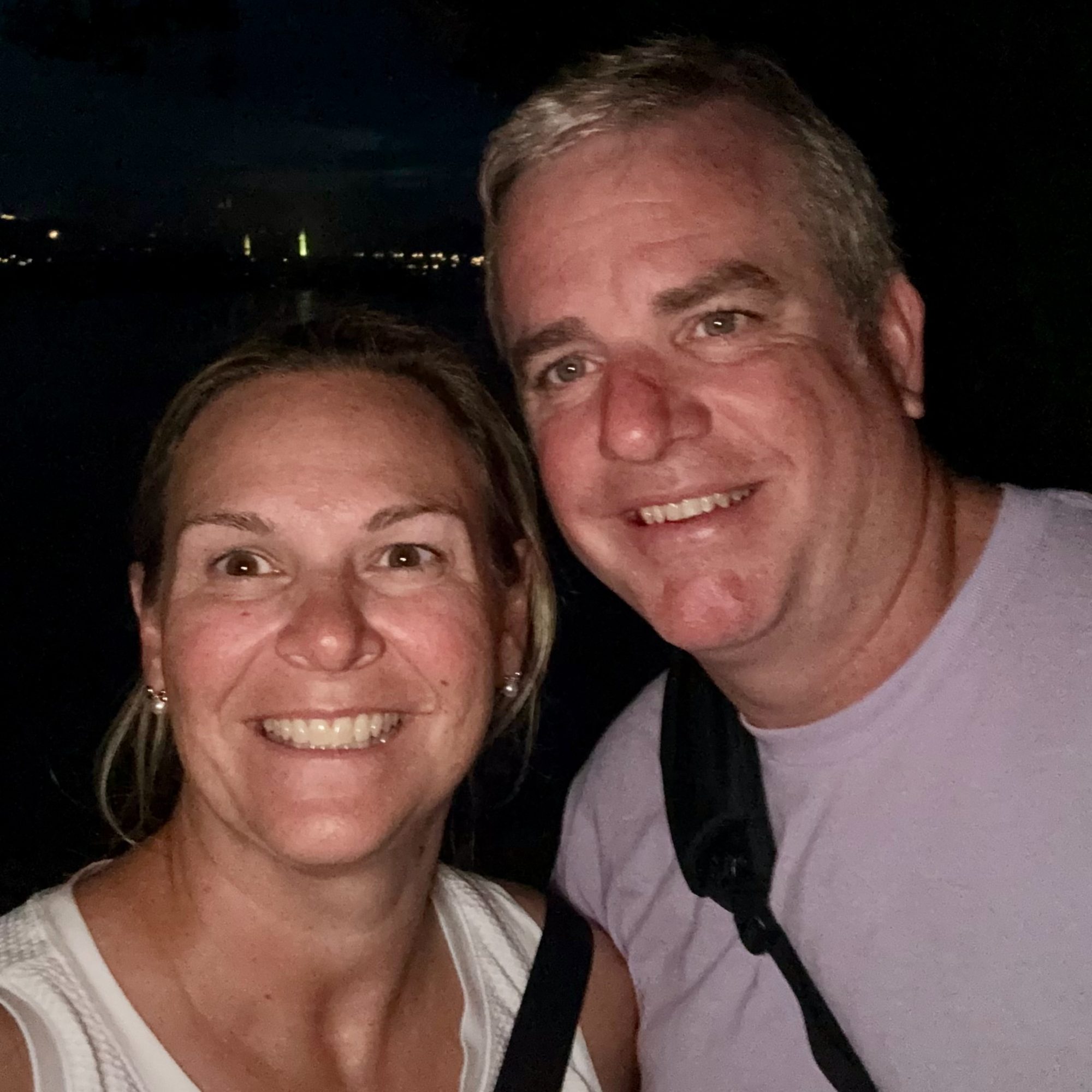 Liz and her husband at Epcot in the evening