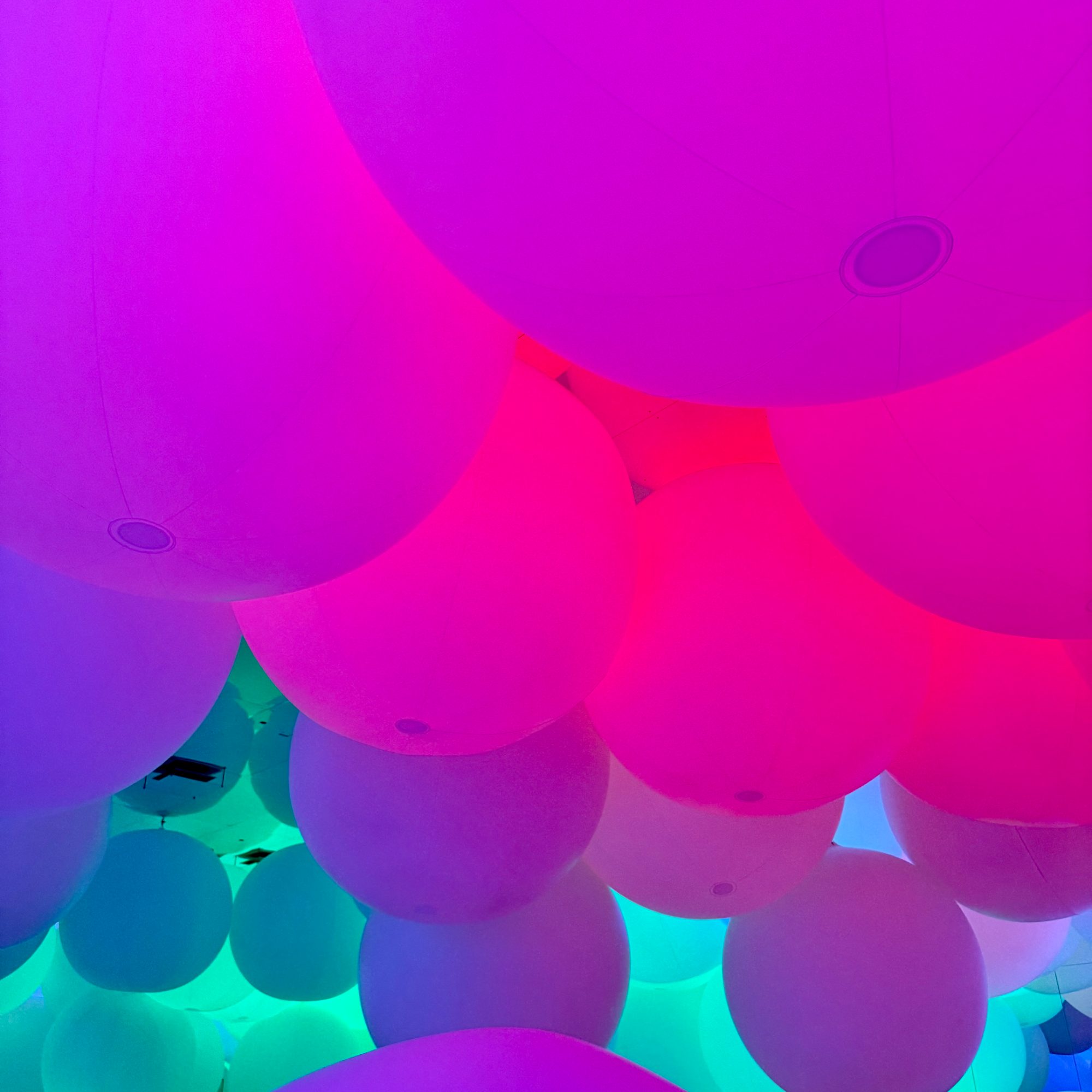 The glowing, oversized ball room at TeamLab Planets