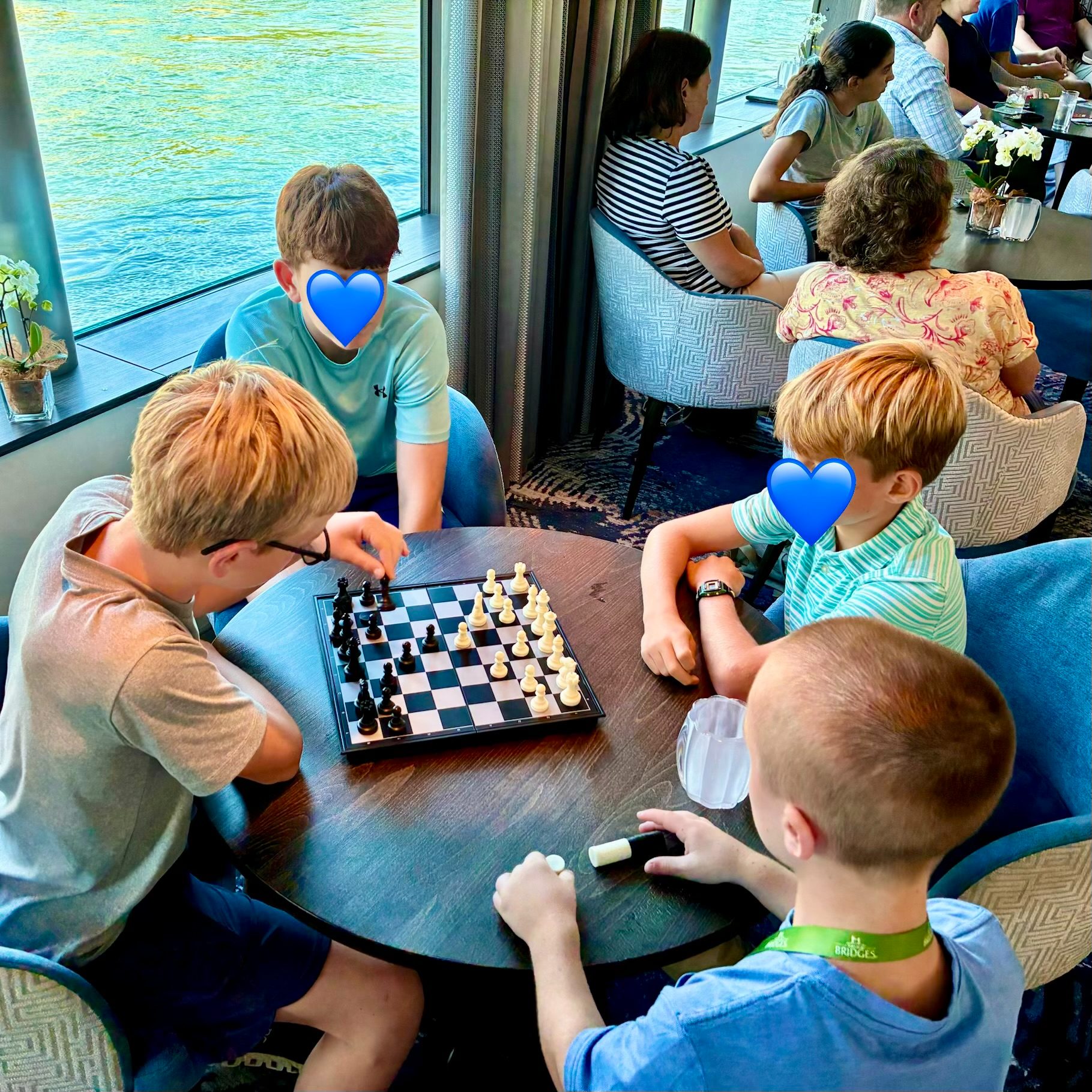 The younger set trading their devices for a game of chess as the ship sails