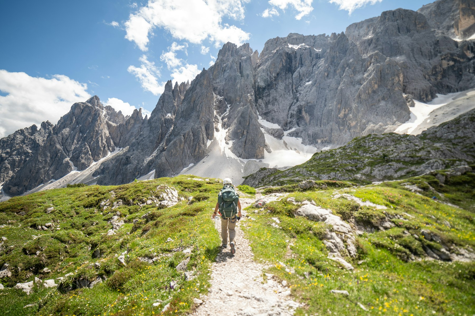 Hiking trail with the Dolomites peaks in view
